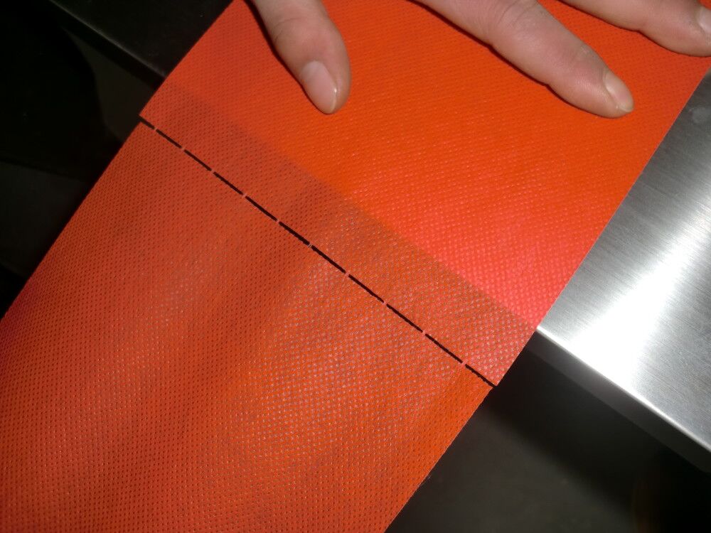 1550219821180799.jpg PERFORATED NONWWOVEN LAMINATED FABRIC Photo 01 AAAAA.jpg